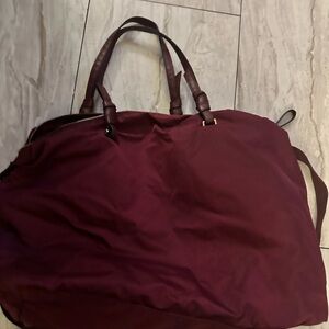 Brown Travel Bag with Leather Handles and Structured Base